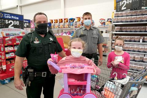 Deputies, Explorers and other members of the Nassau County Sheriff’s Office and various state agencies shop with 333 children during Nassau’s annual Shop with a Cop event. Children are identified based on need and then pair up with officers to shop for clothing, shoes and toys.