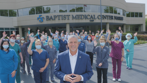 Baptist Medical Center Nassau President Ed Hubel stands with staff in front of the hospital.