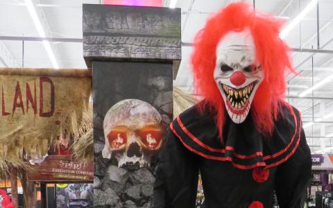 A clown gives an enthusiastic greeting to customers as they step into the scary experience that is Spirit of Halloween. JULIA ROBERTS/NEWS-LEADER