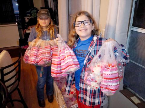 Junior Be The Change Northeast Florida volunteers prepare Valentine’s Day care packages to distribute to the homeless. The non-profit always accepts volunteers to assist with its efforts. Visit https://www.facebook.com/Be-the-Change-NE-Florida-Inc-280042779206525 to learn more.