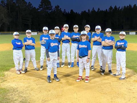 The Warrior Red 10U team dons blue jerseys in support of the Juvenile Diabetes Research Foundation. Two of the teammates have diabetes and the team joined together to raise awareness.