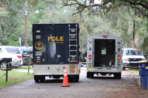 Fernandina Beach Police Department and Florida Department of Law Enforcement officials at the scene of a homicide Monday on S. 13th St. in Fernandina Beach.