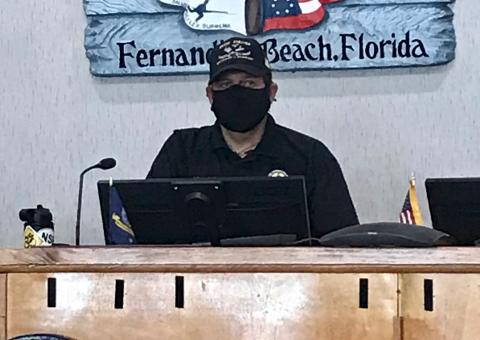 Mayor Johnny Miller of Fernandina Beach wears a mask at a special meeting called Thursday to discuss whether to mandate the wearing of masks in an attempt to slow the spread of the novel coronavirus.  Julia Roberts/News-Leader