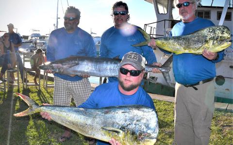 Chris Stephens, Rich Wolford, Bubba Weeks, from left, and Larry Owens, kneeling, teamed up to top some 24 blue water teams during the 26th annual Amelia Island Blue Water Shootout Saturday. TERRY LACOSS/SPECIAL
