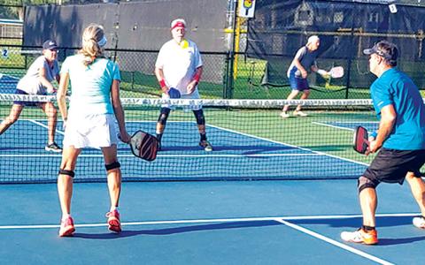 Pictured are 4.0 players Shelly Duncan, Lynn Kunkel, Dan Broome and Carl Creamer in action over the weekend. SPECIAL PHOTO