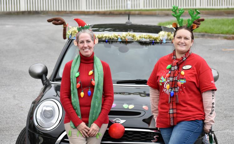 Camden library director Mellissa Clark (right) and children’s specialist Rachael Atterbery decked out themselves and “the holiday gram mobile” last week to deliver holiday cards to every senior facility in Camden County. They’d hoped to get 250 cards, so that each senior would get one. But the kindness of others surprised them as card after card came in until they had more than 1,000 to share.