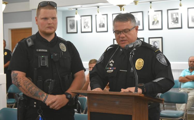 Officer Cameron Wilkinson (left) was recognized for his lifesaving actions.