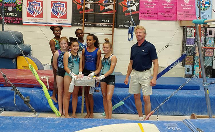 Currently housed in a converted basketball gym, the gymnastics program is anticipating the construction of a new facility dedicated to gymnastics and cheer classes and team formation.
