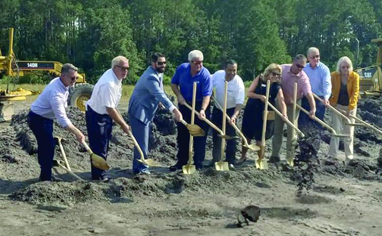 Camden and Plug Power representatives break ground at a ceremony Tuesday at the county industrial park.