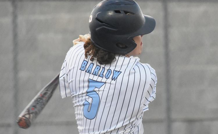 Luke Barlow smacks a hit in the Wildcats' win over Grayson. Andy Diffenderfer/Tribune & Georgian