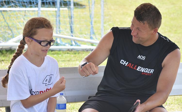 Coach Matt Mountford chats with Rubiana Rivers. (Andy Diffenderfer/Tribune & Georgian)