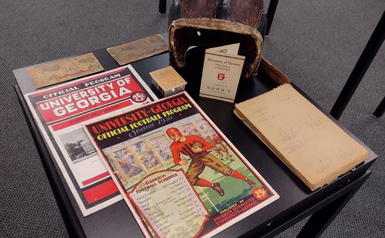 University of Georgia athletics history specialist Jason Hasty brought an exhibit of the school's athletic memorabilia to the St. Marys Library July 27. Among the the treasures were football game programs and ticket stubs dating to the 1920s, including the 1929 UGA-Yale game. (Tribune & Georgian/Andy Diffenderfer)