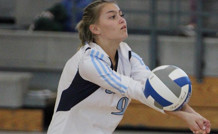 Ansleigh Paul extends the rally in the Lady Wildcats' tri-match Sept. 20. (Andy Diffenderfer, Tribune & Georgian)