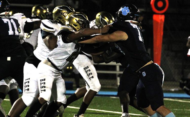 Wildcat defender Dylan Higginbotham draws the attention of B.E.S.T. blockers. (Andy Diffenderfer, Tribune & Georgian)