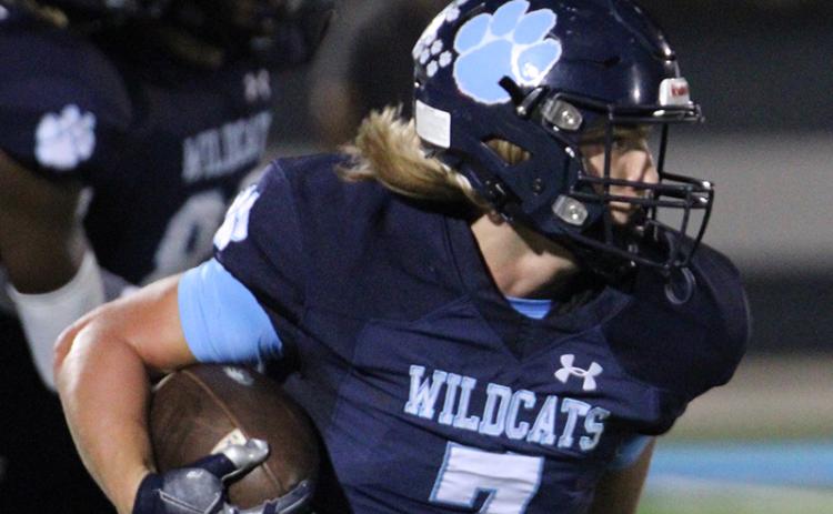 Jake Lindsey returns a punt last Friday night. (Andy Diffenderfer, Tribune & Georgian)