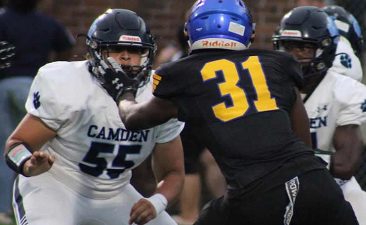 Cayden Thompson tangles with a Brunswick defender. (Scott J. Bryan, Tribune & Georgian)
