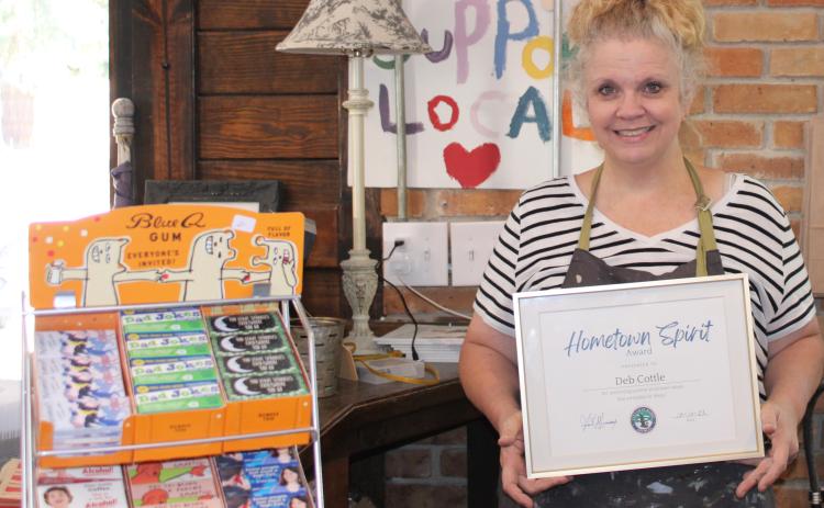 Cottle & Gunn owner Deborah Cottle recently received the city of St. Marys’ Hometown Spirit Award for her commitment to city causes.
