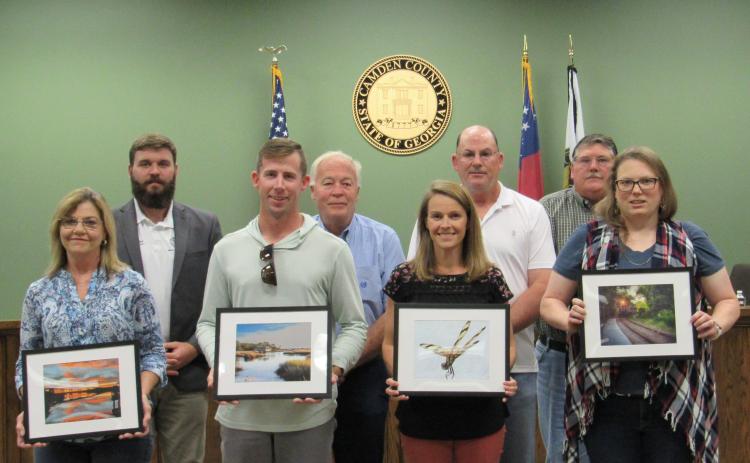 Camden County Photo Contest Winners Frances Lewis, Chandler White, Ashley Rice and Ashley Armstrong pose with their photos and Camden County commissioners.