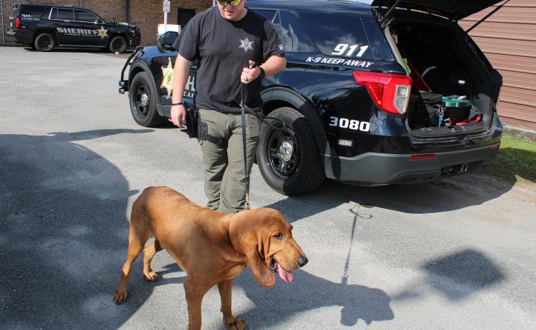 Camden County Sheriff’s Office Sgt. Jay Thames walks his K-9, Jasper, outside the sheriff’s office.