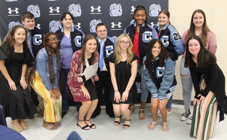 Letter jacket recipients Adam Brewer, Valerie Thompson, Veyonce Covington and Tyson Brodak are with “buddies” Clary Minnick, Zyla Ronan, Riley Copeland, Chloe Moon, Abrianna Antley, Hannah Cassel, Raina Croxton and Natalie Brewer.