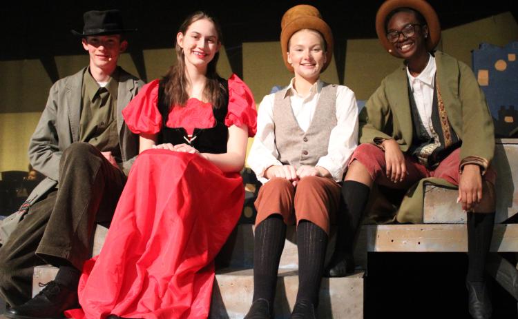Jonathan Foreman (Fagin), from left, Lillie Reihing (Nancy), Aili Johnson (Oliver) and Sinaia’ Williams (The Artful Dodger) star in the Camden County High School Fine Arts Department’s weekend showing of “Oliver.”