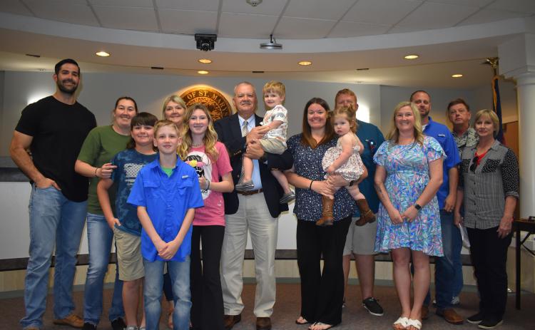 New St. Marys Chief of Police James Galloway celebrates his hire with his family at the St. Marys City Council meeting Monday.
