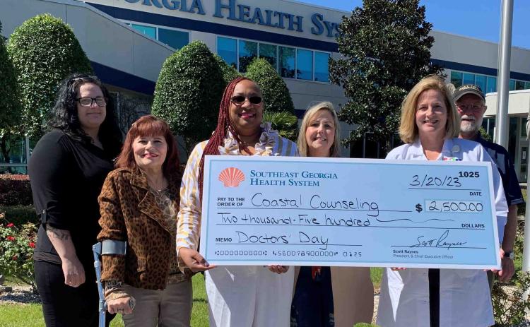 Southeast Georgia Health System Camden Campus Medical Staff Chief Dr. Janise H. Whitesell delivers a $2,500 donation to Coastal Counseling Center and its staff members, Merrisa Kight, Nannette Brannon, Leticia Graham, Tammy Hudson and Dale Blanton.