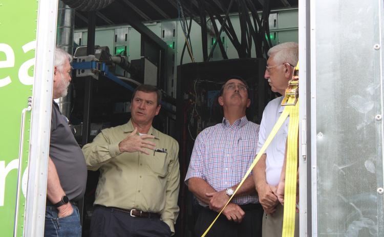 Visitors to the Hydrogen Energy Road Show on Friday tour an 18-wheel truck that is powered completely by hydrogen energy.