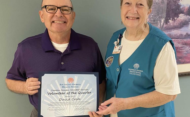 Southeast Georgia Health System Camden Campus’ Volunteer of the Quarter, David Costa, left, accepts his award from Camden Campus Volunteer Services President Kathleen Worthing.