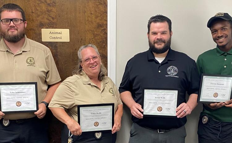 Camden County Board of Commissioners, from left, Animal Control’s Tyler Schlemmer, Tracy Webb, Jerod Wells and Trevyon Simmons recently received certifications from the National Animal Care & Control Association.