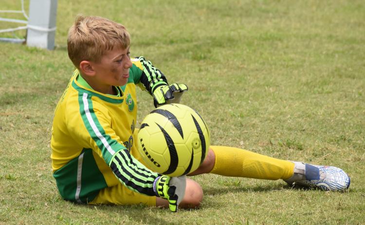 Blake Ludwig stretches for a save at the Challenger soccer camp. (Andy Diffenderfer, Tribune & Georgian)
