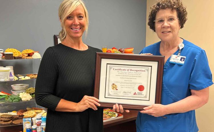 Southeast Georgia Health System’s diabetes educator, Allison Hendry, left, and Diabetes Education program coordinator Sue Ullrich show off an award the hospital recently earned.