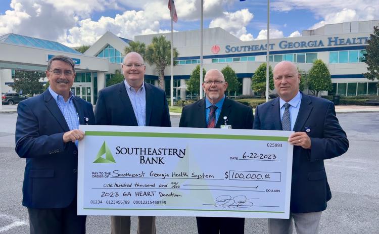 Southeastern Bank recently donated $100,000 to Southeast Georgia Health System’s Camden Campus through the Georgia HEART Hospital Program. From left are Southeastern Bank Senior Vice President Jim Lomis and President and CEO Jay Torbert, Camden Campus Vice President and Administrator Glenn Gan and Southeast Georgia Health System President and CEO Scott Raynes.