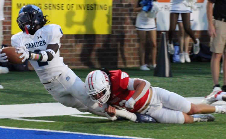 Ja’Marley Riddle stretches for the goal line against Glynn Academy. The senior scored three touchdowns in the Wildcats’ romp last Friday, two rushing and another receiving. (Scott J. Bryan, Tribune & Georgian)