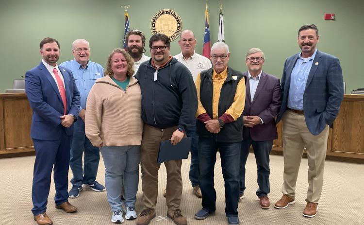 The Camden County Board of Commissioners recently honored Scott Van Osdol as its Employee of the Quarter. From left are County Administrator Shawn Boatright, Commissioner Lannie Brant, Leigh Van Osdol, Commissioner Trevor Readdick, Scott Van Osdol, Chairman Ben Casey, Commissioners Jim Goodman and Martin Turner, and Senior Director of Human Resources and Risk Management Mike Spiers.