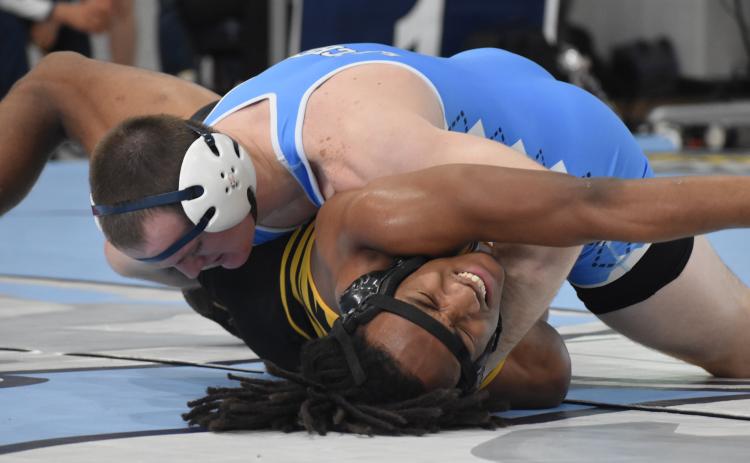 Camden County’s Tripp Fletcher pinned Valdosta’s Karl Rosip last Saturday at the Region 1-7A duals. Camden easily retained the title and will compete at state this weekend in Buford. (Andy Diffenderfer, Tribune & Georgian)