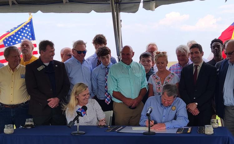 Gov. Brian Kemp signs a bill dubbing white shrimp as the official state crustacean.