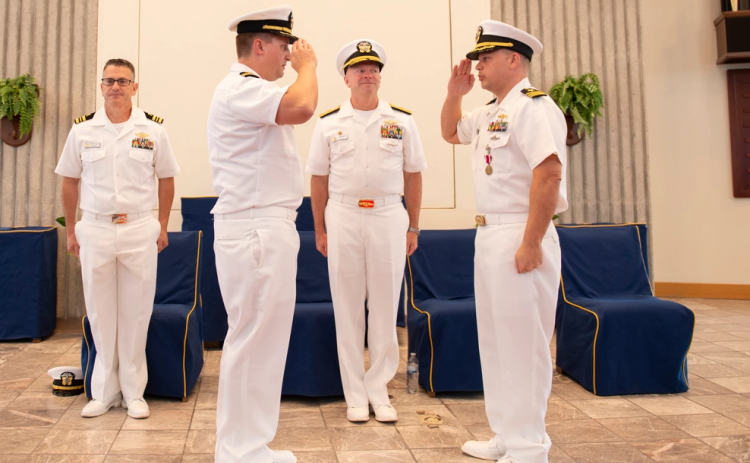 Cmdr. Matt Scovill, right, relinquishes command of Submarine Readiness Squadron 36 (SRS-36) to Cmdr. Matthew Becker on June 14 during a change of command ceremony aboard Naval Submarine Base Kings Bay.