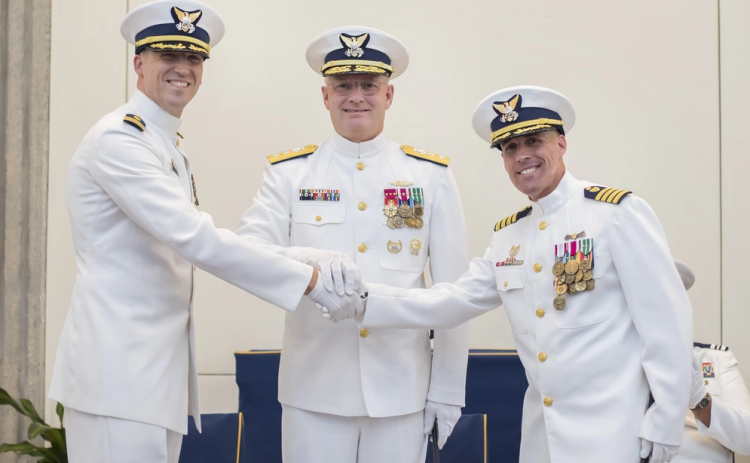 Cmdr. Jeffrey Prebeck assumes command of Coast Guard Maritime Force Protection Unit Kings Bay from Capt. David Vicks during a change of command ceremony July 11 in St. Marys. Rear Adm. Douglas Schofield, commander, Coast Guard Seventh District, presided over the ceremony.
