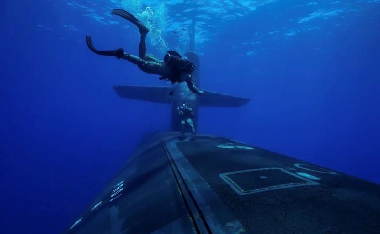Marines from the Second Force Reconnaissance Company conduct dive operations with Ohio-class guided-missile submarine USS Georgia (SSGN 729) while underway in the Mediterranean Sea in July.