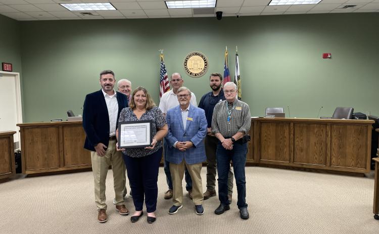 Camden County Senior Director of Human Resources and Risk Management Mike Spiers, Camden County Commissioner Lannie Brant, human resources generalist Amy Peeples, Chairman Ben Casey and Commissioners Martin Turner, Trevor Readdick and Jim Goodman celebrate a recent award.
