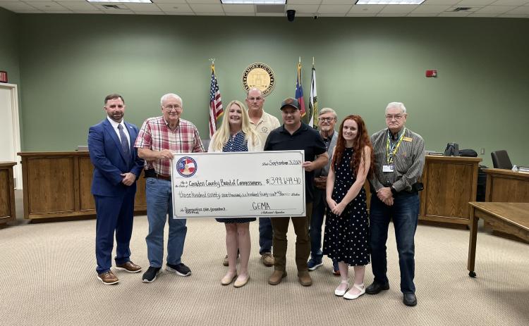 Camden County Administrator Shawn Boatright, from left, Commissioner Lannie Brant, Grants Manager Julie Haigler, Chairman Ben Casey, Maintenance Director Alex Harrellson, Commissioner Martin Turner, Floodplain and Soil and Erosion Coordinator Cassie Turpin and Commissioner Jim Goodman celebrate the county’s hazard mitigation grant.
