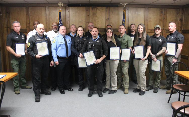 ABOVE: Camden County Sheriff Kevin Chaney recognized Camden County Sheriff’s Office employees and area agencies for their contribution during an active-shooter event Jan. 8. BELOW: Chaney awards deputy Dakota Todd her certificate. To view more photos from the event, visit the Tribune & Georgian’s Facebook page.