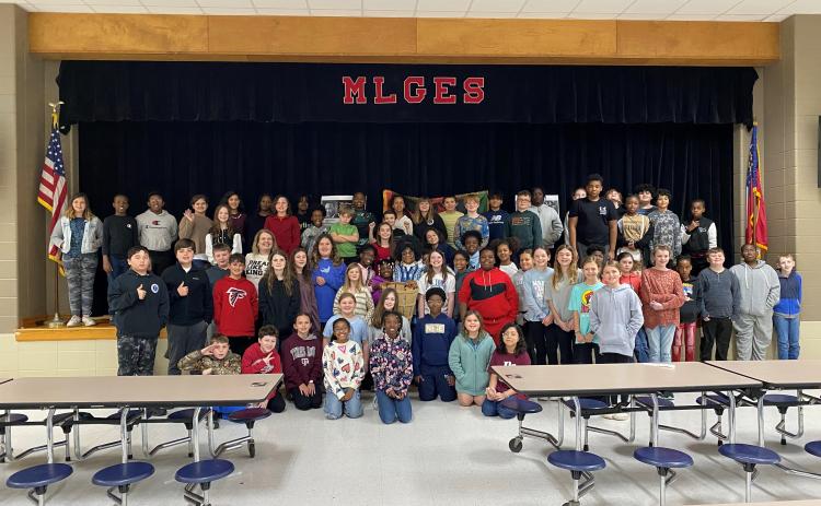 Camden Middle School sixth-grade assistant principal Leatha Massey recently shared with Mamie Lou Gross Elementary fifth-graders her experience meeting Dr. Martin Luther King Jr. when she was a student at Morris Brown College in Atlanta.