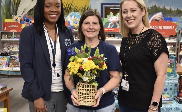 Camden County Schools Superintendent Tracolya Green, left, and Mary Lee Clark Elementary School Principal Rika Dow, right, honor the school district’s Media Specialist of the Year, Ardith Sweatt.