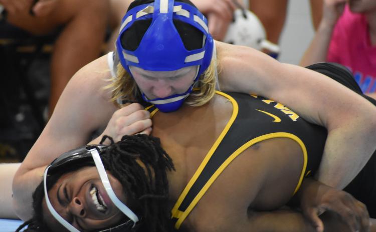 Camden County High School’s Hunter Prosen, top, wrestles against Valdosta’s Elijah Barnes during the Region 1-6A dual tournament in Kingsland.