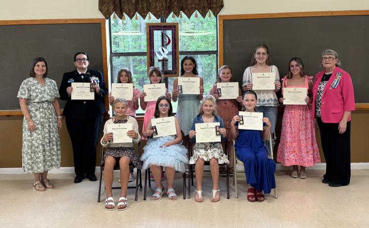 Winners of the Daughters of the American Revolution’s awards were, front row, from left, Mary Lee Clark Elementary’s Libby Bubp, Sugarmill Elementary’s Silje Sherven, Crooked River Elementary’s Charlotte Cimaglia and Matilda Harris Elementary’s Evangeline Everett. Back row: Earl of Camden’s Ardith Sweatt, Camden County High School JROTC’s Brooke Salazar, David L. Rainer Elementary’s Kinley Wilson, Woodbine Elementary’s Charlotte Horn, St. Marys Middle School’s Windsor Lane Weaver, Mamie Lou Gross Elementary