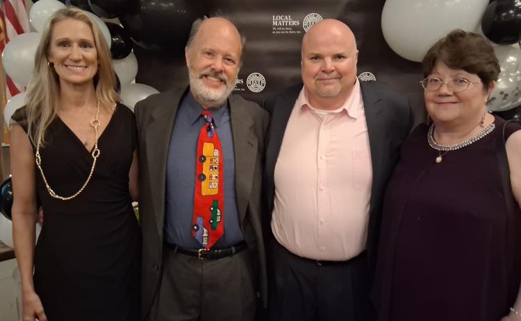 The Tribune & Georgian won eight awards at the Georgia Press Association’s Better Newspaper Contest banquet. From left are Marketing Director Laurie Levine, Assistant/Sports Editor Andy Diffenderfer, Editor and Publisher Scott J. Bryan and Production Director Denese Proctor.