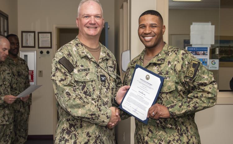 Former U.S. Navy Capt. Chris Bohner, left.
