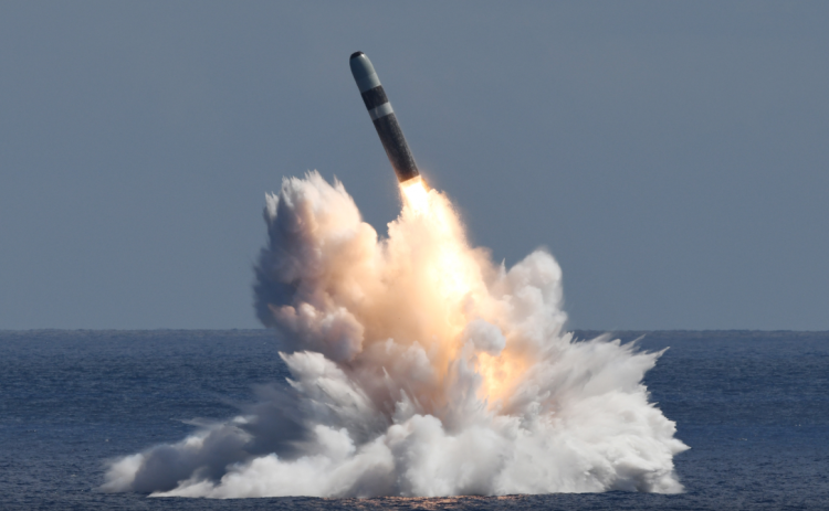 An unarmed Trident II D5 Life Extension missile launches from an Ohio-class ballistic submarine off the coast of Florida.